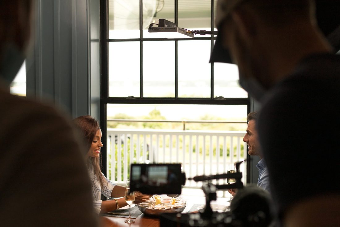 Camera operator framing a lifestyle scene